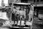 A Chinese businessman travels with a truck full of imported Chinese goods with his Angolan workers, Luanda, Angola, 2007