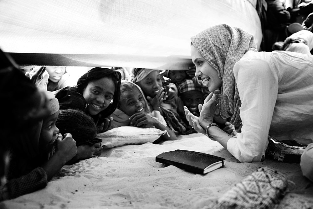Angelina Jolie, the Oscar winning actress and UNHCR Goodwill Ambassador, meets with children in a refugee camp. Angelina Jolie spent two days visiting Oure Cassoni, a refugee camp outside Bahai, Chad, 2007, close to the Darfur border. Almost 27,000 refugees live there and it was opened in 2004.