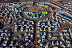 SOWETO, SOUTH AFRICA - JULY 19: An aerial view of newly constructed apartment complexes on July 19, 2018 in Kliptown section of Soweto, South Africa.  Soweto has seen some of the largest developments in infrastructure with shopping malls, public transport etc. South Africaís largest township is now almost self-sufficient whereas before the residents had to buy things in Johannesburg. (Photo by Per-Anders Pettersson/Getty Images)