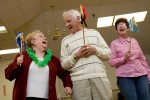 Senior citizens participate in a round of {quote}human horse racing{quote} at the Elks Club's annual dinner dance for seniors.