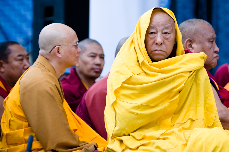 A Buddhist monk keeps warm during the visit of His Holiness the Dalai Lama to New England.