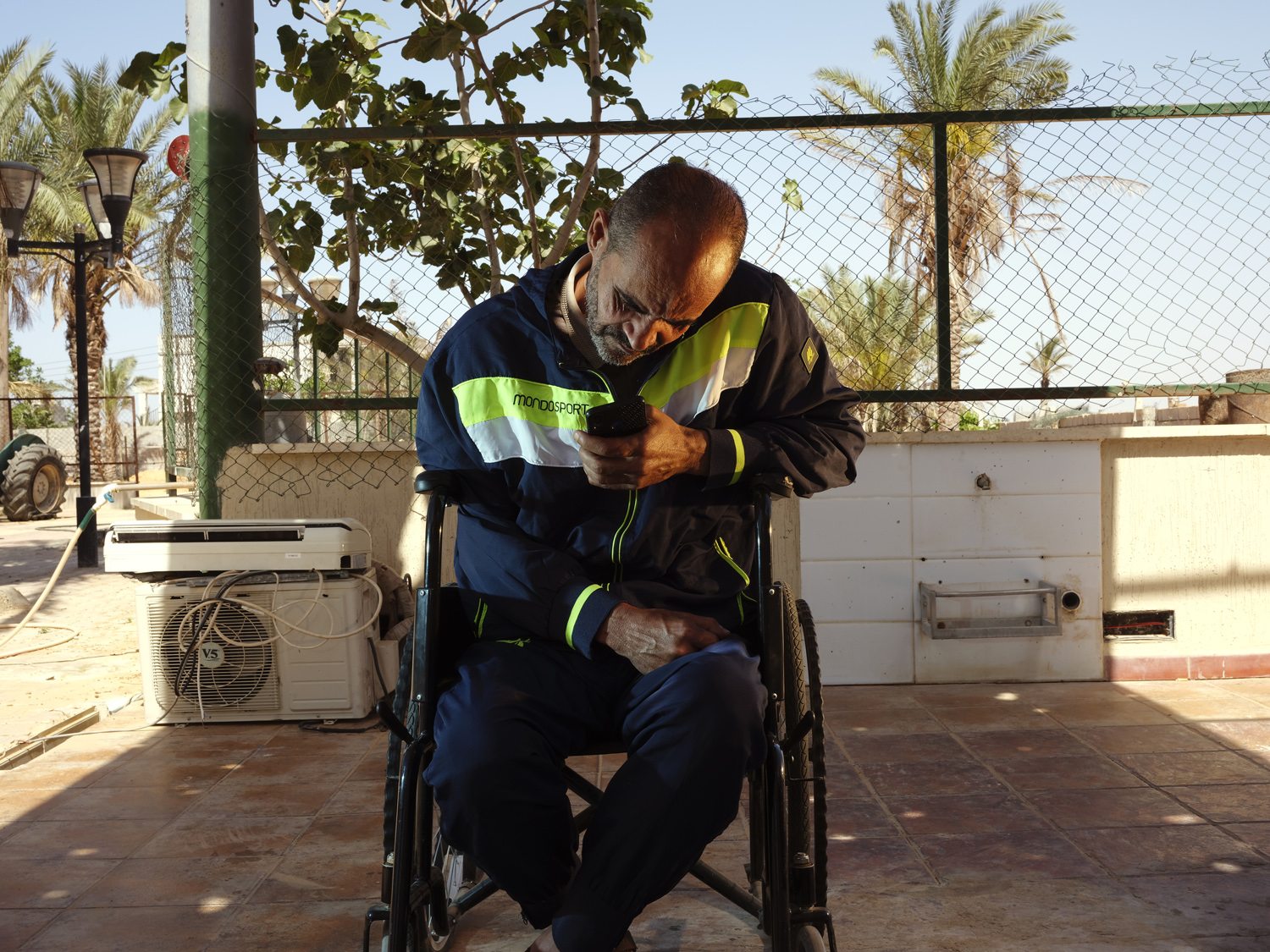 Tripoli, Libya 05/04/2021Ain Zara resident Abdel Moala-Abdel Aziz (48yrs) fled his neighborhood in 2019 as conflict raged around his family home. Upon his return Abdel suffered a stroked and has been in a wheelchair. He says the stroke was brought by the shock related to the 2019 conflict. The Ain Zara district in Tripoli saw the worse of the fighting that raged through Tripoli in 2019. With the humanitarian situation deteriorating most of the residents fled and abadoned both their homes and businesses. Today the former front lines remains much empty and destroyed. Jehad Nga