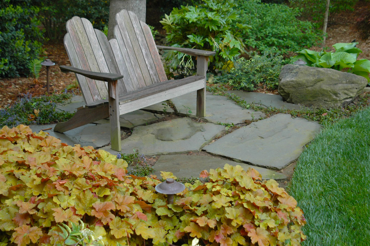 An intimate spot to enjoy the beauty that abounds throughout this Myers Park backyard.