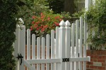 Entrance into this {quote}secret garden{quote} is accessed through the classic white picket fence...