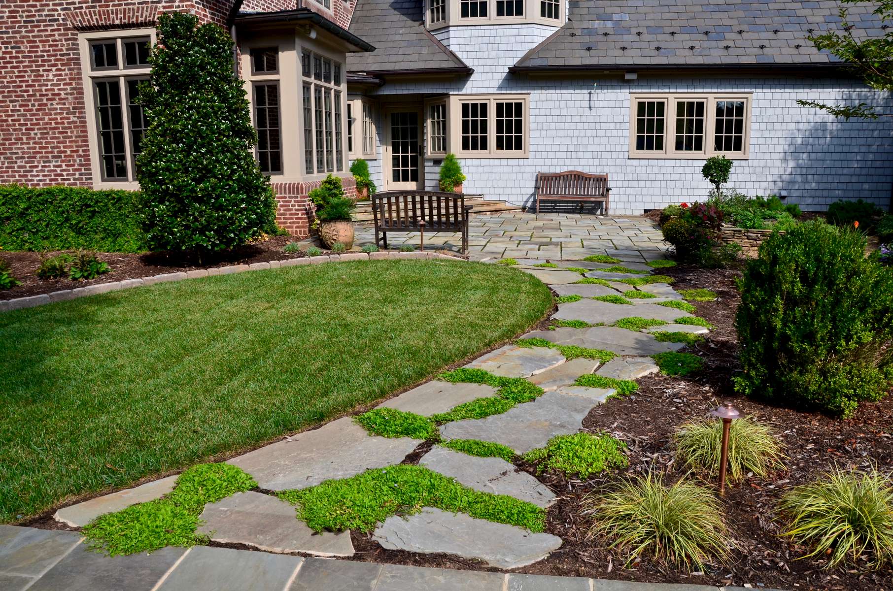 Enter friends & family; this tranquil meanering stepping stone path leads to the kitchen (side) entry of the residence. Culinary exploration is encouraged with the family's private herb garden located just steps away out the kitchen door...