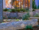Magnificent stacked stone walls definfine the back yard into threMagnificent stacked stone walls definfine the back yard into three level terraces, anchoring and settling the home to its outdoor environment. Palatial steps glide from the upper lawn around a lushly planted mid-level into a garden-encased lawn at the lower terrace.e level terraces, anchoring and settling the home to its outdoor environment. Palatial steps glide from the upper lawn around a lushly planted mid-level into a garden-encased lawn at the lower terrace.