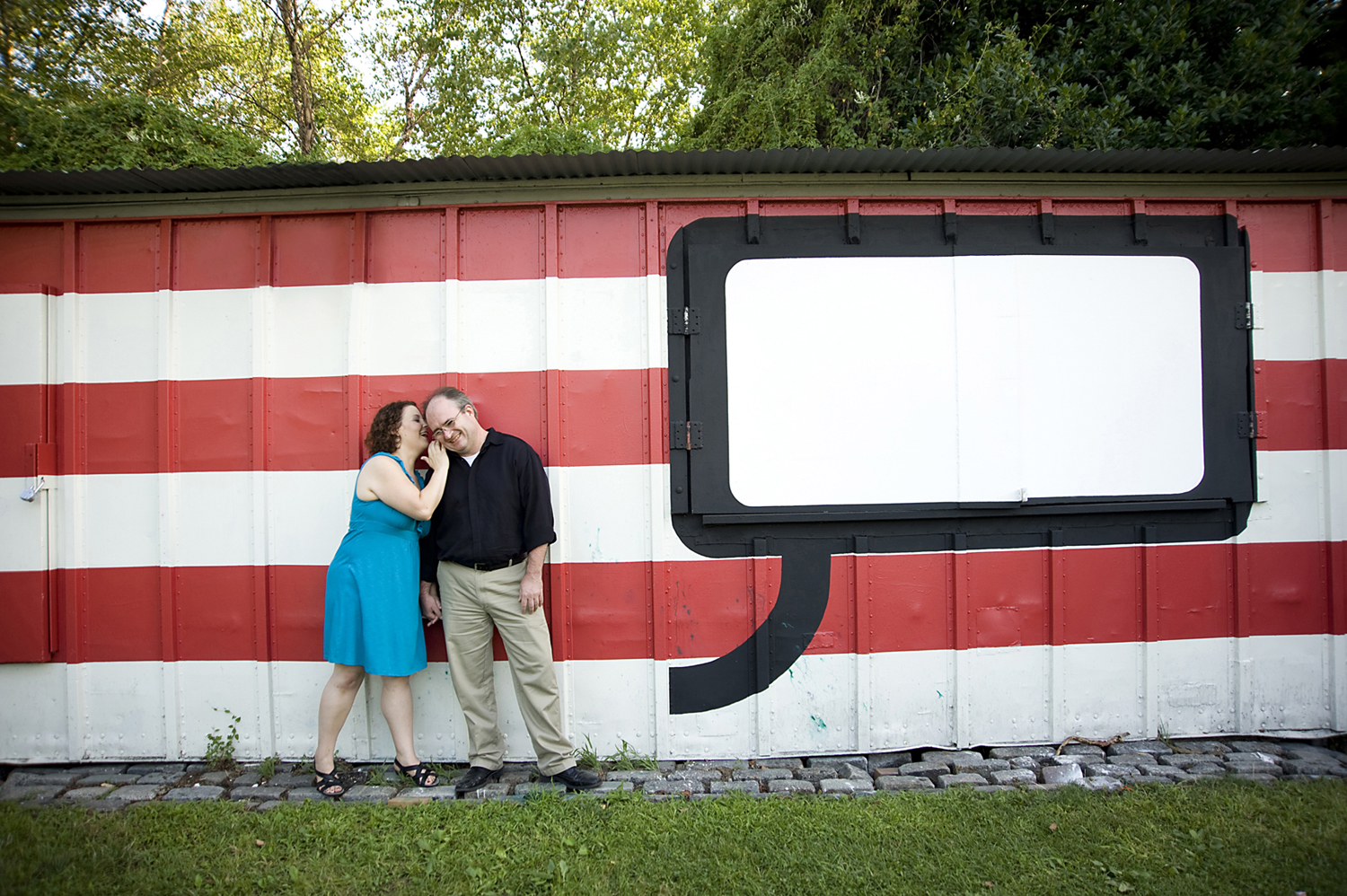 couple at Socrates Sculpture Park in Queen for engagement photos. Queens wedding photographers