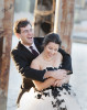 black and white wedding dressed bride and her groom laughing