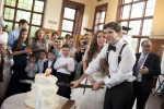 groom cuts wedding cake with sword at Celebrate at Snug Harbor