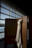 wedding dress hangs in sunlight at The Lighthouse at Chelsea Piers, New York City