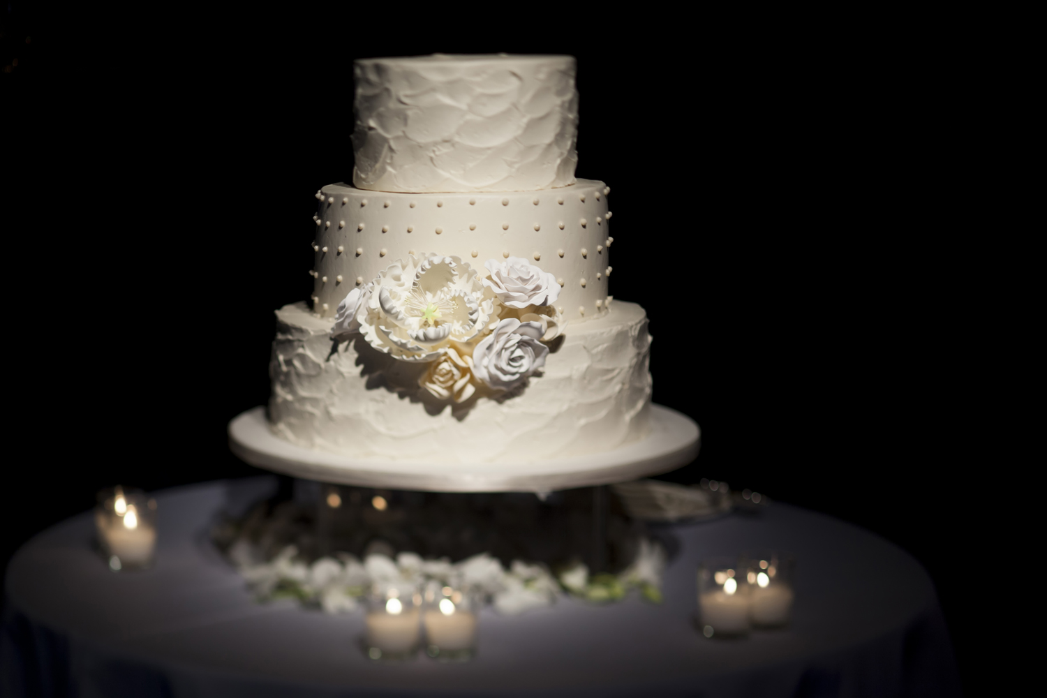 white wedding cake with white flowers, NYC wedding photographers