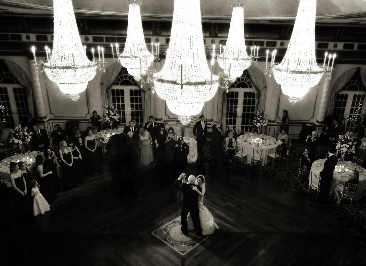 Father daughter dance under the chandeliers of Crystal Plaza. 