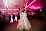 Brides dancing together for their first dance during the reception of their wedding at Liberty House. NYC gay-friendly wedding photographers