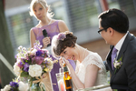bride wipes away tear during her sister's toast at Queens Botanical Garden wedding