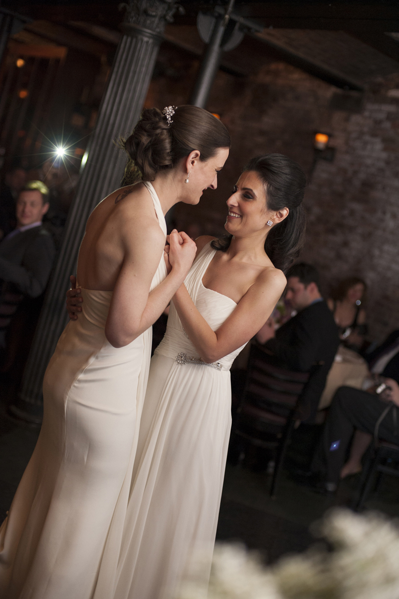Brides dance their first dance at City Hall Restaurant, NYC. New York City Lesbian wedding