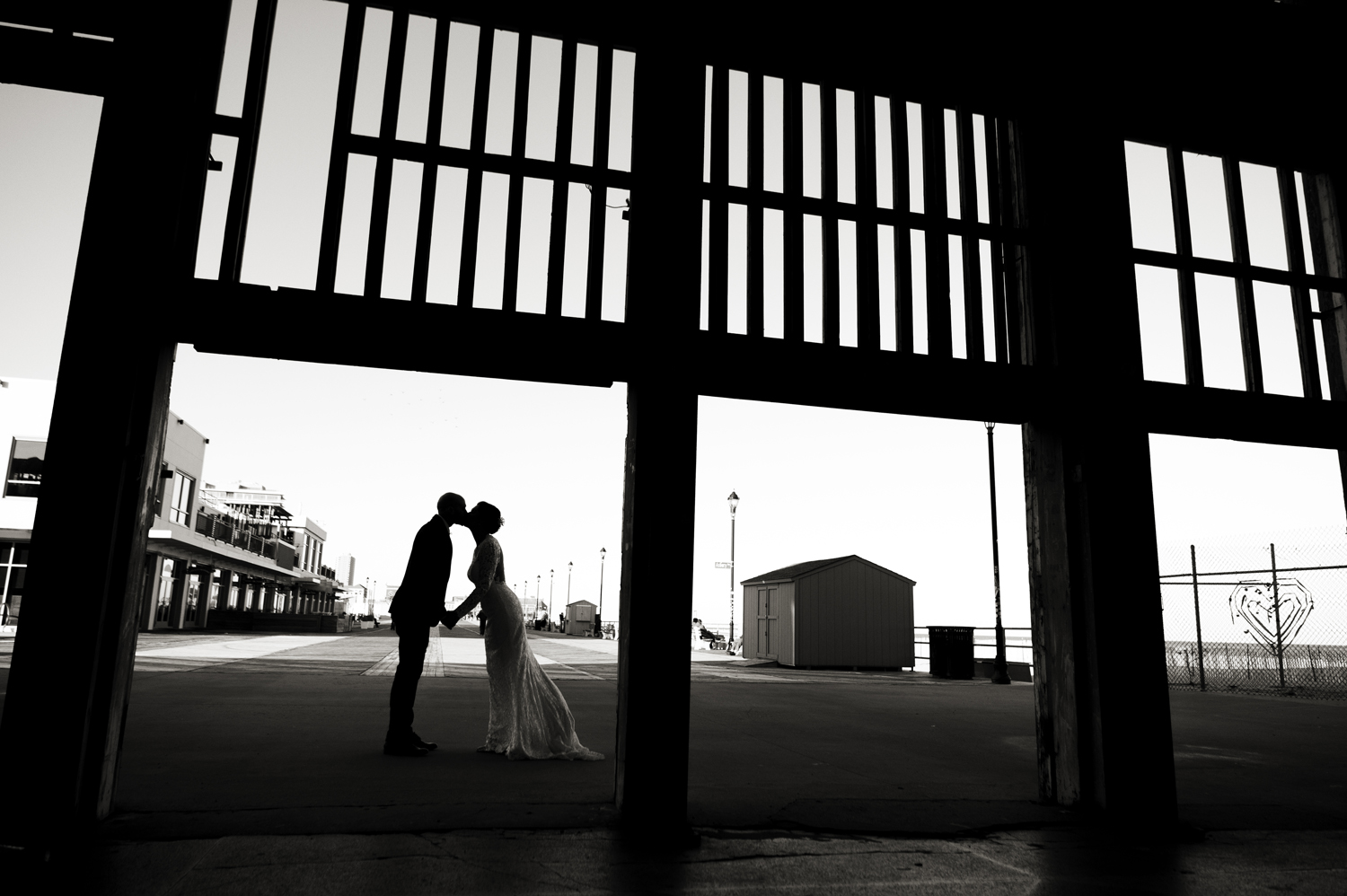 bride and groom kiss at the Asbury Park Casino on the Asbury Park Boardwalk. Asbury Park wedding photographer