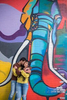 engaged couple against elephant mural in DUMBO Brooklyn during their engagement session. Brooklyn wedding photographers