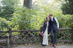 Bride and groom posing for portrait in Central Park