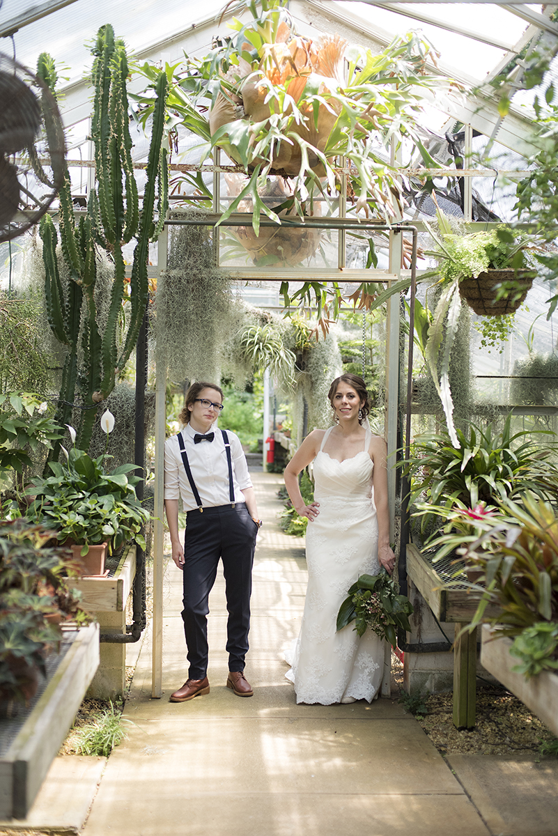 Lesbain wedding couple in greenhouse at Deep Cut Gardens