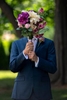 Groom holding wedding bouquet