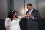 a touch of superman on their wedding day during photos in Liberty State Park. Jersey City wedding photographers