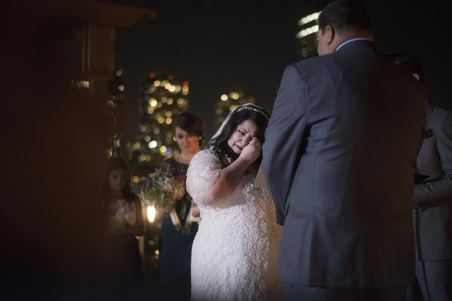 bride tears up during her wedding ceremony at Liberty House in Jersey City. Jersey City wedding photographers