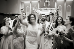 Bride and groom dance down the aisle after completion of their traditional Jewish wedding ceremony at Temple Emanu-El in Closter. 
