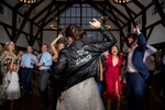 bride in leather jacket dancing during wedding reception at Crossed Keys Estate
