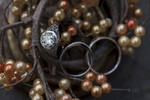 detail of wedding rings against ring box and fall decor. NJ wedding photographer