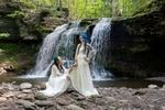 Nordic brides in front of waterfall
