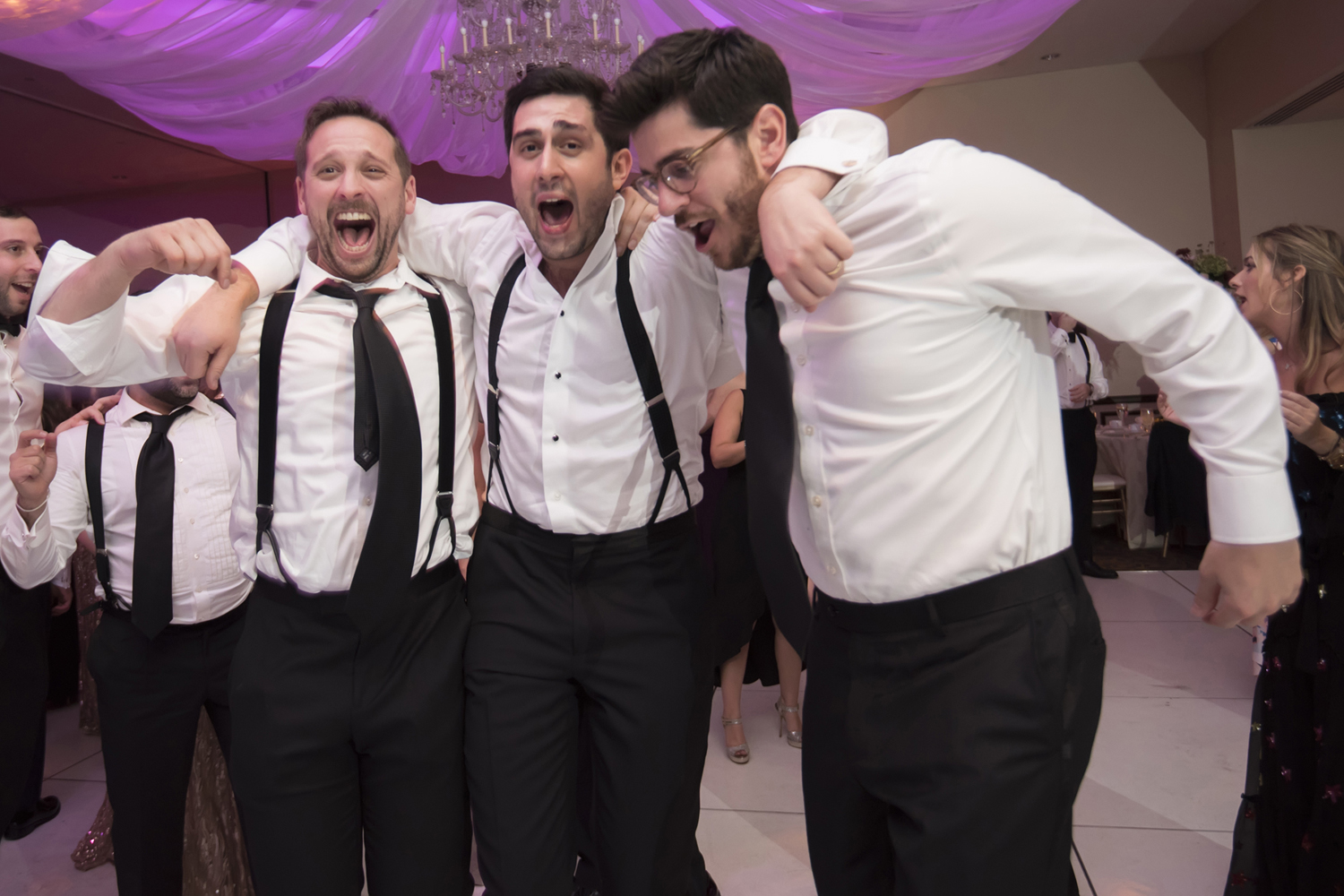 groom and his friends dancing at the reception of his  Jewish wedding at Temple Emanu-El in Closter. NJ wedding photographer