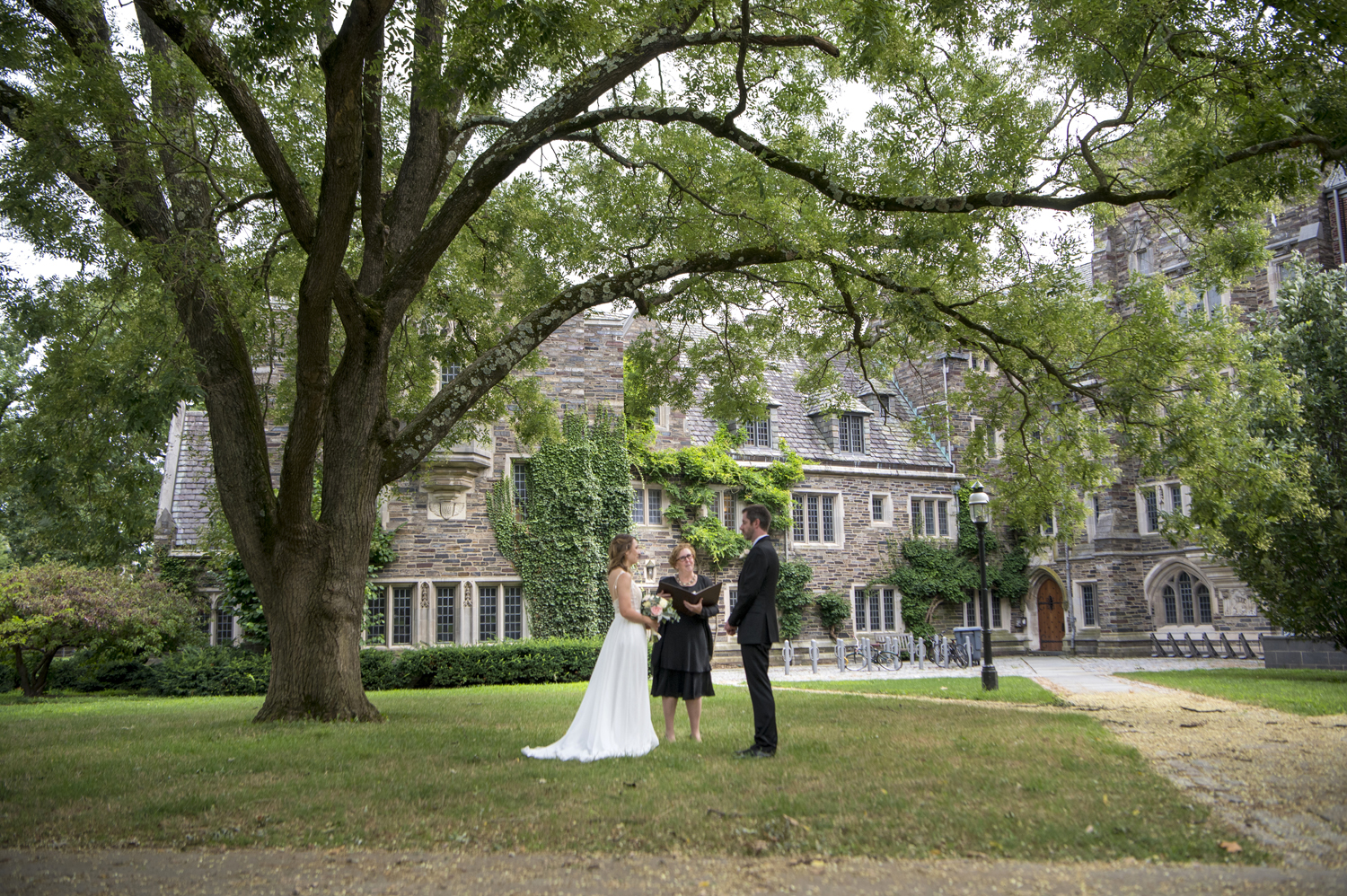 bride and groom are married under a tree on Princeton University's campus. Princeton microwedding. Princeton wedding photographer