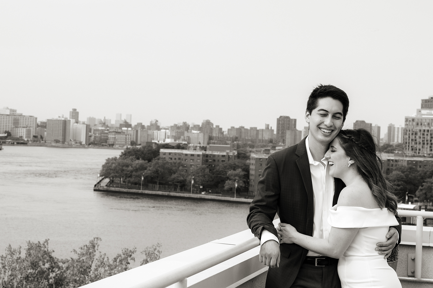 portrait of bride and groom on their wedding day on rooftop in Astoria, Queens. Queens wedding photogrpher