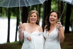 brides rainy wedding day at Windows on the Water at Frogbridge. LGBTQ wedding
