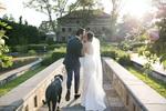 bride, groom, and their dog at the conclusion of their wedding ceremony at Celebrate at Snug Harbor. 