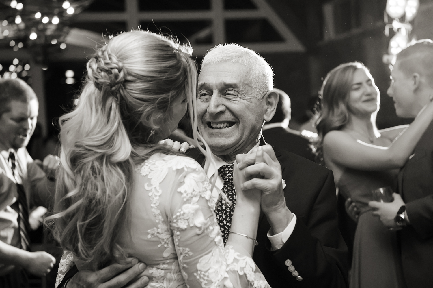Grandfather dances with bride at The Lodge at Stirling Ridge