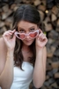 bride posing for a wedding portrait at Stone House in Stirling Ridge with heart-shaped sunglasses

