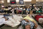 These gravelyill evacuees awaited further aid by the baggage  claim carousels. Some patients were stabilized and given there medications, but the medical personel were overwhelmed by the volume. Next to one of the patient dispatch areas (which was fomerly a traveler lounge area as part of the airport) was a temporary morgue, where one medical worker said that personel would take DNA samples from the bodies before embalming them and placing them in refrigerated trucks on the premises. 