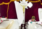 Diana, 7, reached into a coffin as she laid eyes on her 2-year-old brother, Brian, for the first time. Her slain mother lay in her coffin to her right. 
