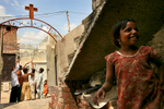 PROJECTS - DO NOT DELETE - SEE PAULA NELSON BEFORE RUNNING PHOTO - 8/26/2006 - Children play in the streets of Sheikhupura, Pakistan, a mixed Christian/Muslim community outside of Lahore. The Christians of Pakistan are generally very poor.  {quote}USAID funded faith-based aid abroad{quote} - Pakistan -  Dina Rudick/Globe Staff. Story by Susan Milligan/Globe Staff.