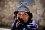 2/25/11 - Cuenca, Ecuador - Maria Avelina Cela, the mother of murder victim Maria Avelina Palaguachi-Cela, waited on a curb outside the Cuenca morgue for her daughter and grandson's bodies to be released.  