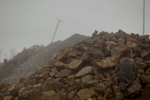 2/26/11 - Cañar Province; Ecuador - A young girl blends into a pile of rocks next to her home, high in the Andes in an isolated pocket of Ecuador. This is a scene setter near the home of Murder suspect Luis Guaman's estranged wife. Guaman is now in an Ecuadoran prison charges of forgery and using a false passport. He left behind four sons when he immigrated to the United States to work. He is the primary suspect in the bludgeoning deaths of Maria Avelina Palaguachi-Cela and her 2-year-old son, Brian. Story by Maria Sacchetti/Globe Staff. Dina Rudick/Globe Staff.