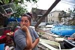 7/28/14 - Revere, MA - Barbara Cardone, cq, surveys the damage done to her formerly orderly back yard on Taft Street. A tornado ripped through Revere, MA on Monday morning, July 28, 2014. Item: 29weather. Dina Rudick/Globe Staff