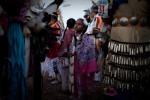 A young girl waits in line for the pow wow to begin in Pine Ridge, South Dakota.  Many of the tribal elders feel a loss of tradition and respect among the youth. 