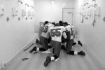 Members of the Tampa Bay Buccaneers huddle to say a prayer in the shower room of the visitors' locker room at the Pontiac Silverdome.