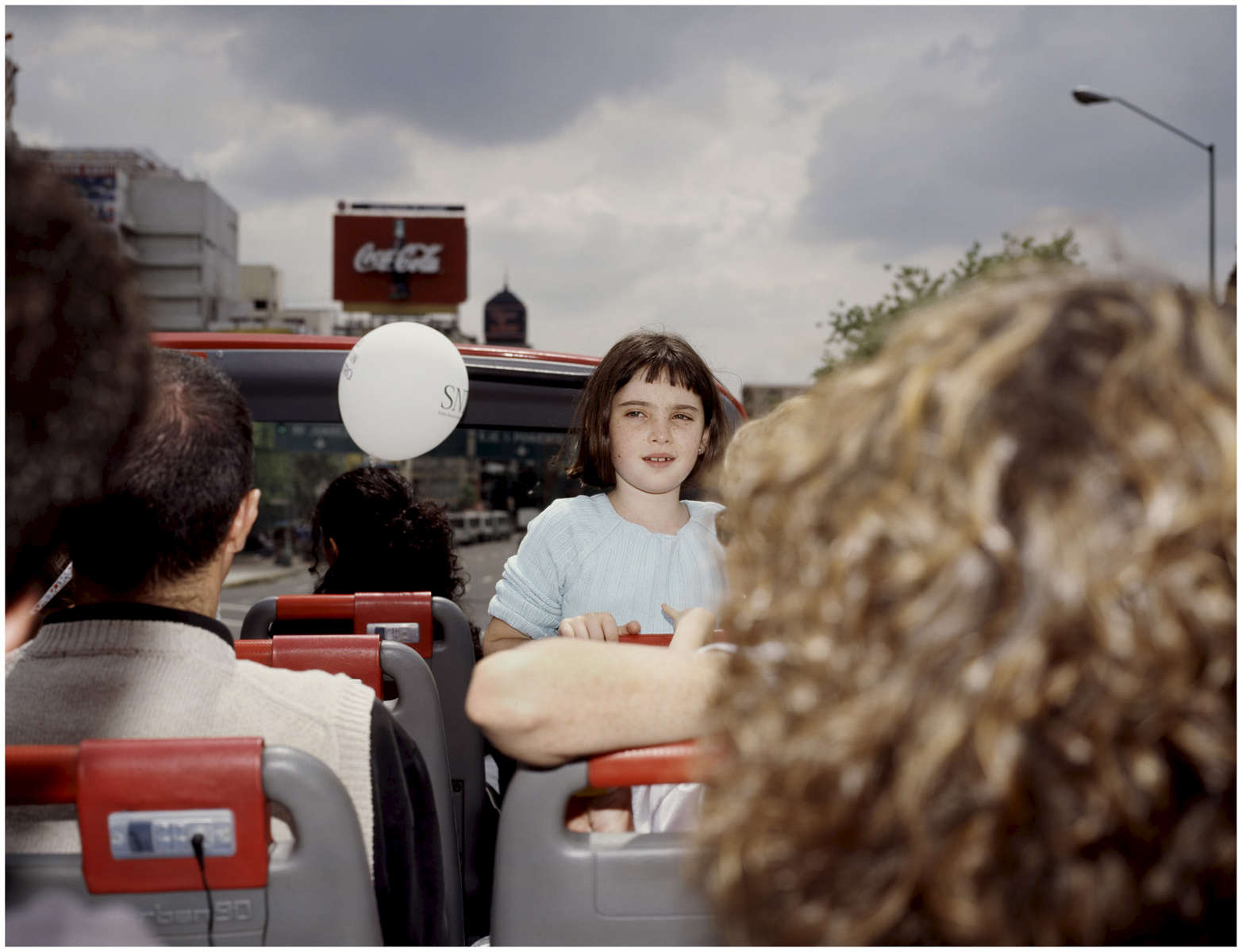 A young girl enjoys a ride on the Mexico City double decker tourbus {quote}Turibus{quote}, part of the landscapes of tourism series, Mexico City 2004. Exhibited in the Salon Malafama as part of the {quote}Vacaciones{quote} series, Mexico City July, 2006