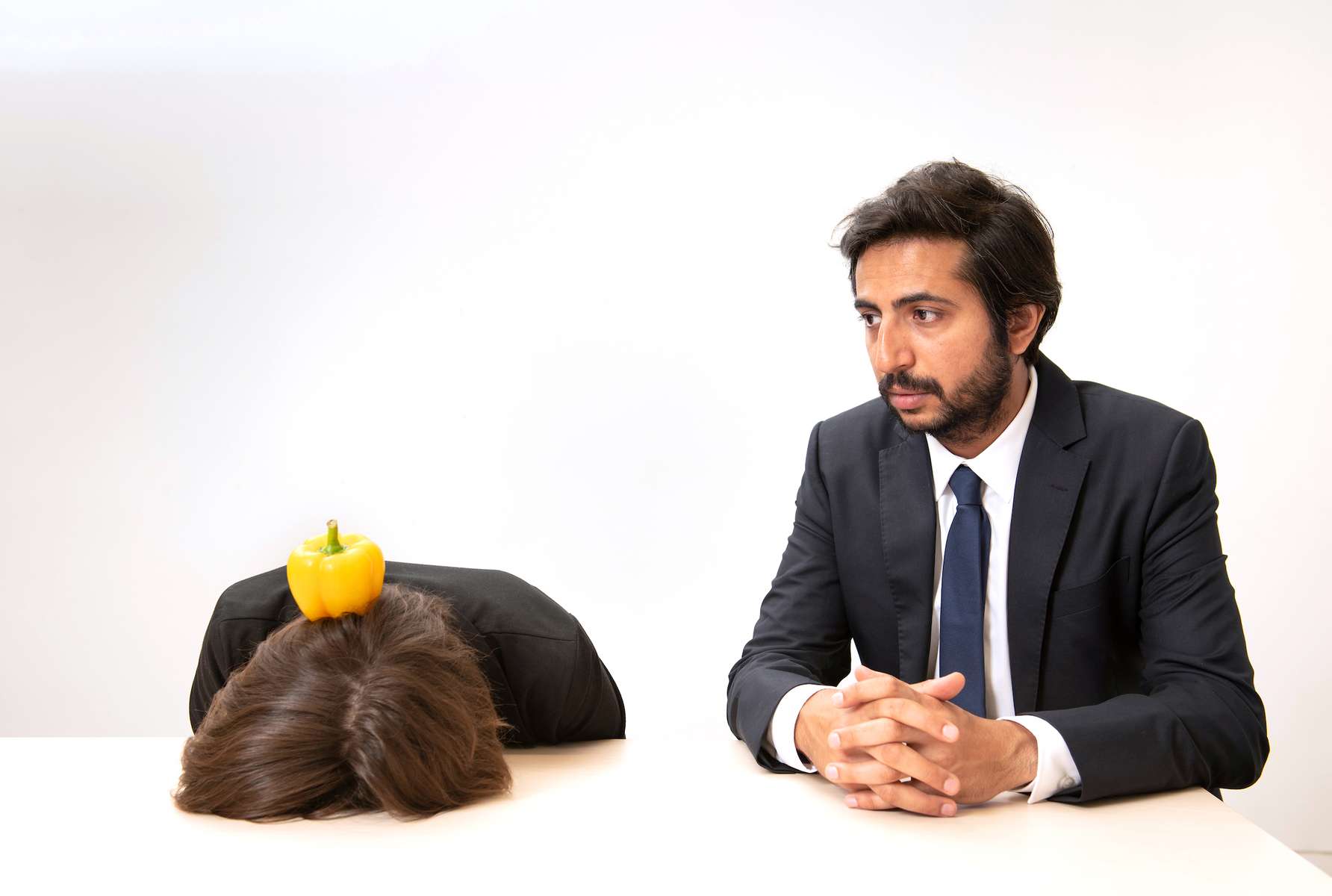 Laure Stockley and Hasan Waliany. Photoshoot for Obstacle, absurd corporate scenes at the Hassell offices, London, UK