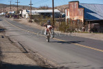A dirt bike does a wheelie down main street in Randsburg California, a {quote}living ghost town{quote} that attracts off road and motocross motorcyclists during the cooler winter weather in this Mojave Desert location. To purchase this image, please go to my stock agency.