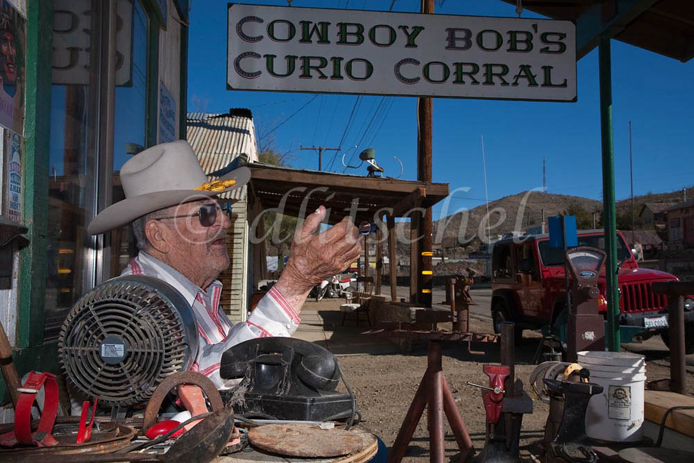 Cowboy Bob Keiser sits outside his Cowboy Bob's Curio Corral, an antique store, located in the {quote}living ghost town{quote} of Randsburg, California. To purchase this image, please go to my stock agency.