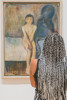 Woman looking at Edvard Munch painting